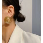 Wholesale Metal big Stud Earrings with mirror-like round button design in 18K gold-plated copper from junejewelry.com—factory price, free shipping.