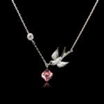 Wholesale bird necklace featuring Swarovski elements and copper and gold plating from junejewelry.com. Cute cartoon character jewelry for resale.