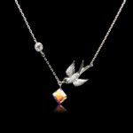 Wholesale bird necklace featuring Swarovski elements and copper and gold plating from junejewelry.com. Cute cartoon character jewelry for resale.