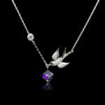 Wholesale bird necklace featuring Swarovski elements and copper and gold plating from junejewelry.com. Cute cartoon character jewelry for resale.