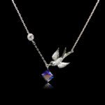 Wholesale bird necklace featuring Swarovski elements and copper and gold plating from junejewelry.com. Cute cartoon character jewelry for resale.