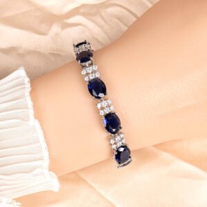 Wholesale Zircon Charm Bracelet featuring clear sparkling stones on platinum plated copper from JuneJewelry.com.