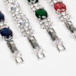 Wholesale Zircon Charm Bracelet featuring clear sparkling stones on platinum plated copper from JuneJewelry.com.