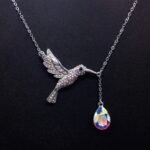 Wholesale Flying Bird Teardrop Necklace featuring genuine Swarovski crystals and platinum-plated copper bird design from junejewelry.com—factory price, free shipping.​
