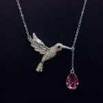 Wholesale Flying Bird Teardrop Necklace featuring genuine Swarovski crystals and platinum-plated copper bird design from junejewelry.com—factory price, free shipping.​