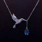 Wholesale Flying Bird Teardrop Necklace featuring genuine Swarovski crystals and platinum-plated copper bird design from junejewelry.com—factory price, free shipping.​