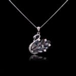 Bulk animal swan pendant necklace with genuine Swarovski crystals and platinum-plated copper—trendy wholesale design from junejewelry.com.