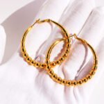 Wholesale Bead Hoop Earrings featuring oversized copper hoops with bamboo segments and round bead accents, plated in 18K gold or platinum from junejewelry.com—factory price, free shipping.