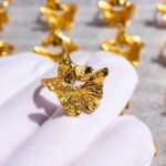 Wholesale Artistic Butterfly Open Ring featuring delicate butterfly motifs on an open copper band plated in 18K gold and platinum from junejewelry.com—factory price, free shipping.