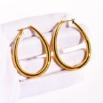 Wholesale Oval Teardrop U-Shape Clip Earrings featuring oversized teardrop and geometric hollow U-shape clip in 18K gold-plated copper from junejewelry.com—factory price, free shipping.