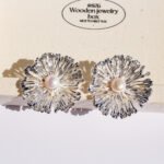 Wholesale statement flower earrings featuring a firework design, pearl accents, and available in 18K gold and platinum plated copper from junejewelry.com