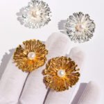 Wholesale statement flower earrings featuring a firework design, pearl accents, and available in 18K gold and platinum plated copper from junejewelry.com