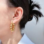 Wholesale Olive Bead U-Shape Hoop Earrings featuring olive seed beads on a copper band plated in 18K gold and platinum from junejewelry.com—factory price, free shipping.