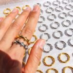 Wholesale Industrial Ball Gear Ring featuring dual-row spheres and gear motifs in 18K gold plated copper from junejewelry.com—factory price, free shipping.