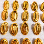 Wholesale Vintage Swirl Oval Drop Stud Earrings featuring exaggerated swirl motif and geometric oval studs on 18K gold-plated copper from junejewelry.com—factory price, free shipping.