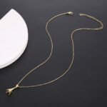 Wholesale Eiffel Tower Necklace featuring micro pave zircon crystals on platinum-plated copper—factory-price, free shipping from junejewelry.com