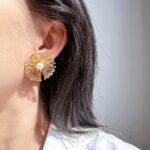 Wholesale statement flower earrings featuring a firework design, pearl accents, and available in 18K gold and platinum plated copper from junejewelry.com