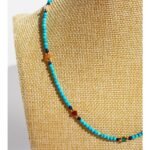 Wholesale blue turquoise beaded necklace featuring natural turquoise beads, a delicate design, and 18K gold plated copper from junejewelry.com