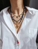 Wholesale lapis lazuli layering necklace featuring lapis beads, a gold coin pendant, shell accents, and 18K gold plated copper from junejewelry.com