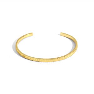Wholesale gear cuff bangle featuring a minimalist design and 18K gold plated copper from junejewelry.com