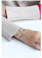 Wholesale CZ open cuff bangle featuring a minimalist design and 14K gold plated brass from junejewelry.com