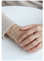 Wholesale CZ open cuff bangle featuring a minimalist design and 14K gold plated brass from junejewelry.com