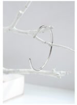 Wholesale CZ open cuff bangle featuring a minimalist design and 14K gold plated brass from junejewelry.com