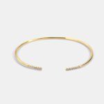 Wholesale cubic zirconia cuff bracelet featuring a minimalist design and 14K gold plated copper from junejewelry.com