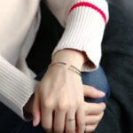 Wholesale cubic zirconia cuff bracelet featuring a minimalist design and 14K gold plated copper from junejewelry.com