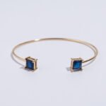 Wholesale cz cuff bracelet featuring a minimalist design and 14K gold plated copper from junejewelry.com