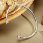 Wholesale dual CZ cuff bracelet featuring a minimalist design and 14K gold plated copper from junejewelry.com