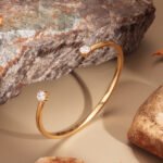 Wholesale dual CZ cuff bracelet featuring a minimalist design and 14K gold plated copper from junejewelry.com