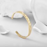 Wholesale Irregular Cuff Bracelet featuring convex-concave hammered texture on a 14K gold-plated copper band from junejewelry.com—factory price, free shipping.