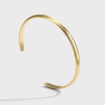 Wholesale C shape cuff bracelet featuring a minimalist design and 14K gold plated copper from junejewelry.com