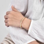 Wholesale Good Luck cuff bracelet featuring a minimalist design and 14K gold plated copper from junejewelry.com