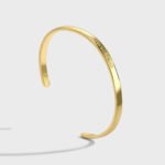 Wholesale Good Smile cuff bracelet featuring a minimalist design and 14K gold plated copper from junejewelry.com