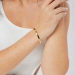 Wholesale Good Smile cuff bracelet featuring a minimalist design and 14K gold plated copper from junejewelry.com