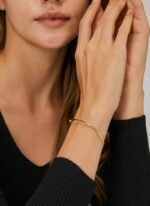 Wholesale CZ cuff bracelet featuring a minimalist design and 14K gold plated copper from junejewelry.com