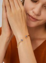 Wholesale geometric zirconia bracelet featuring a minimalist design with triangular CZ stones and 14K gold plated copper from junejewelry.com