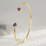 Wholesale geometric zirconia bracelet featuring a minimalist design with triangular CZ stones and 14K gold plated copper from junejewelry.com