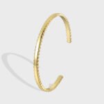 Wholesale geometric cuff bracelet featuring a minimalist geometric design and 14K gold plated copper from junejewelry.com