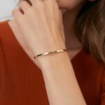 Wholesale geometric cuff bracelet featuring a minimalist geometric design and 14K gold plated copper from junejewelry.com