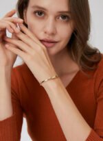 Wholesale geometric cuff bracelet featuring a minimalist geometric design and 14K gold plated copper from junejewelry.com