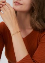 Wholesale lightning cuff bracelet featuring a minimalist lightning bolt design and 14K gold plated copper from junejewelry.com