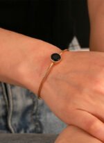 Wholesale European-style black agate cuff bracelet featuring a minimalist design and 14K gold plated copper from junejewelry.com