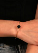 Wholesale European-style black agate cuff bracelet featuring a minimalist design and 14K gold plated copper from junejewelry.com