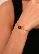 Wholesale European-style black agate cuff bracelet featuring a minimalist design and 14K gold plated copper from junejewelry.com