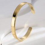 Wholesale European-style modern cuff bracelet featuring a minimalist design and 14K gold plated copper from junejewelry.com