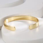 Wholesale European-style modern cuff bracelet featuring a minimalist design and 14K gold plated copper from junejewelry.com