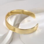 Wholesale European-style modern cuff bracelet featuring a minimalist design and 14K gold plated copper from junejewelry.com